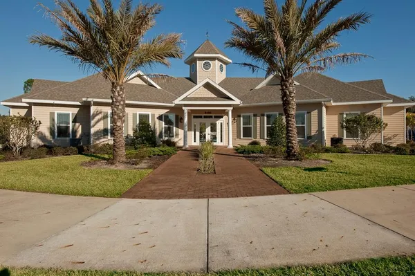 a view of a backyard with swimming pool
