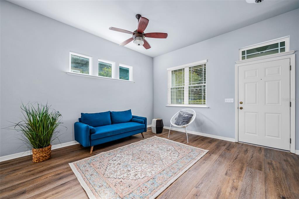7891 Southwest 82nd Drive Gainesville, FL 32608 - Photo 4 of 38 a living room with furniture and wooden floor