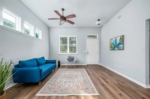 a living room with a couch and a window