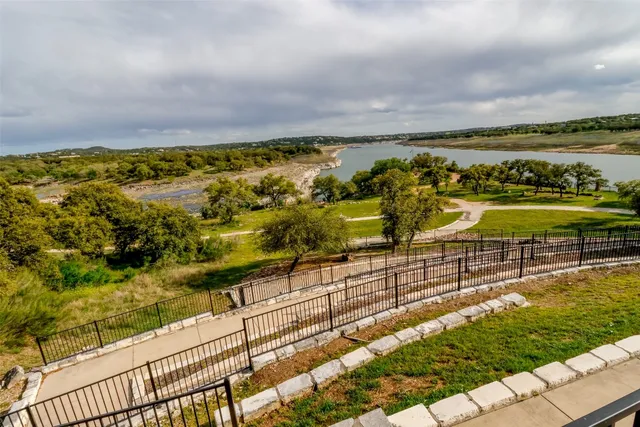 a view of a park with large trees