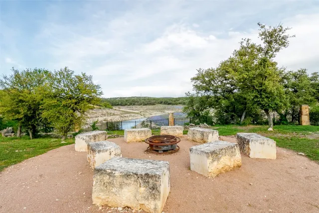 a living room with a large window a couch and a table