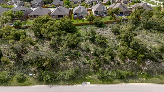 an aerial view of residential house with outdoor space
