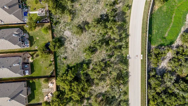 an aerial view of a house with a lake view