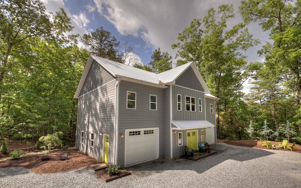130 Mountain Tops Road Blue Ridge, GA 30513 - Photo 1 of 1 a front view of a house with a tree