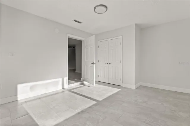 a view of storage and utility room with racks on the wall