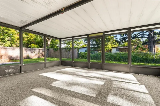 a swimming pool with outdoor seating and yard
