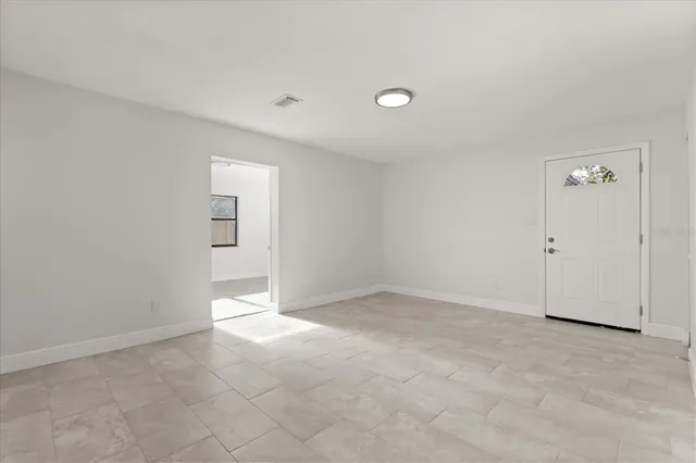 an empty room with windows