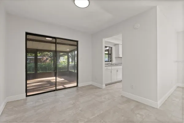 a view of an empty room with glass door