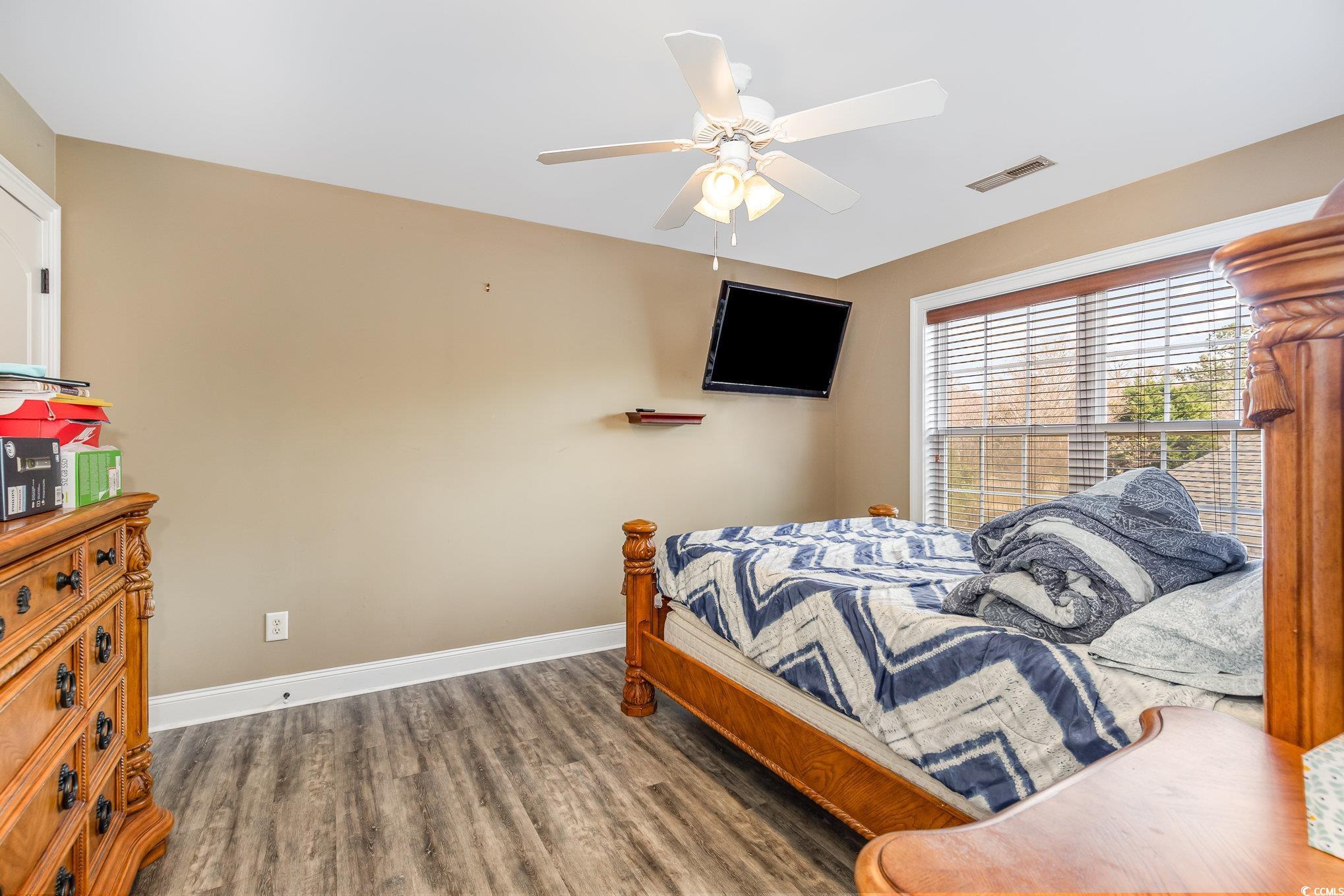 1069 Cole Court Myrtle Beach, SC 29577 - Photo 14 of 40 Bedroom with wood finished floors and a ceiling fan
