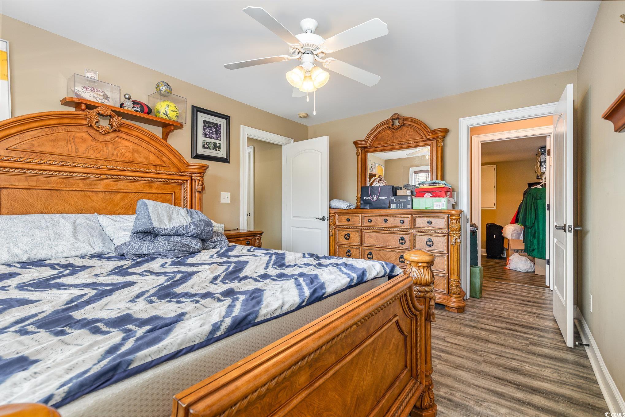 1069 Cole Court Myrtle Beach, SC 29577 - Photo 15 of 40 Bedroom featuring dark wood-style floors and ceiling fan