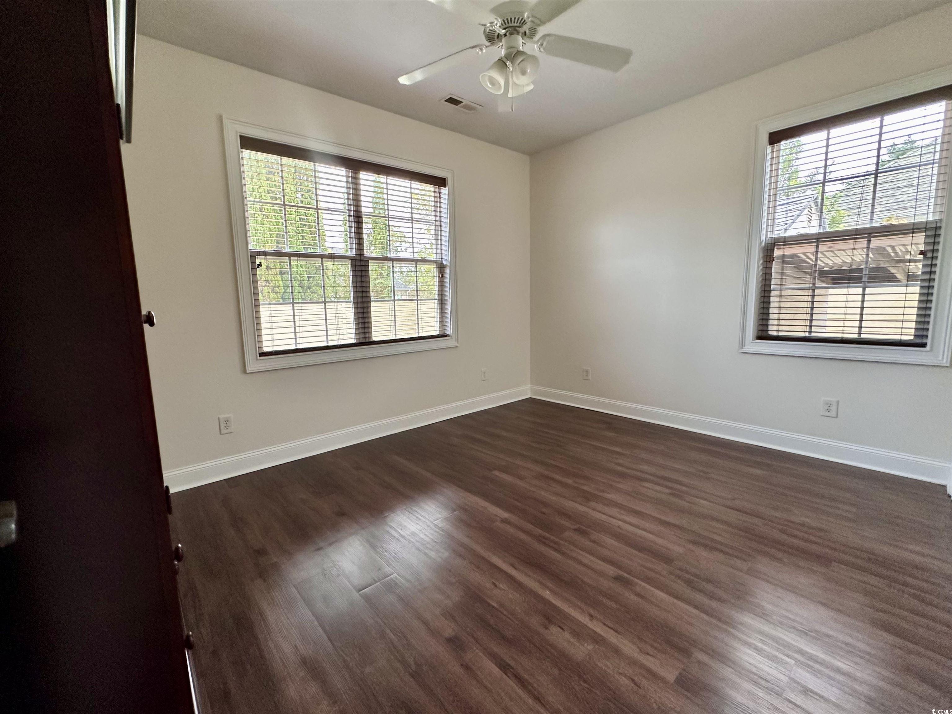 1069 Cole Court Myrtle Beach, SC 29577 - Photo 23 of 40 Unfurnished room with dark wood-style flooring and ceiling fan