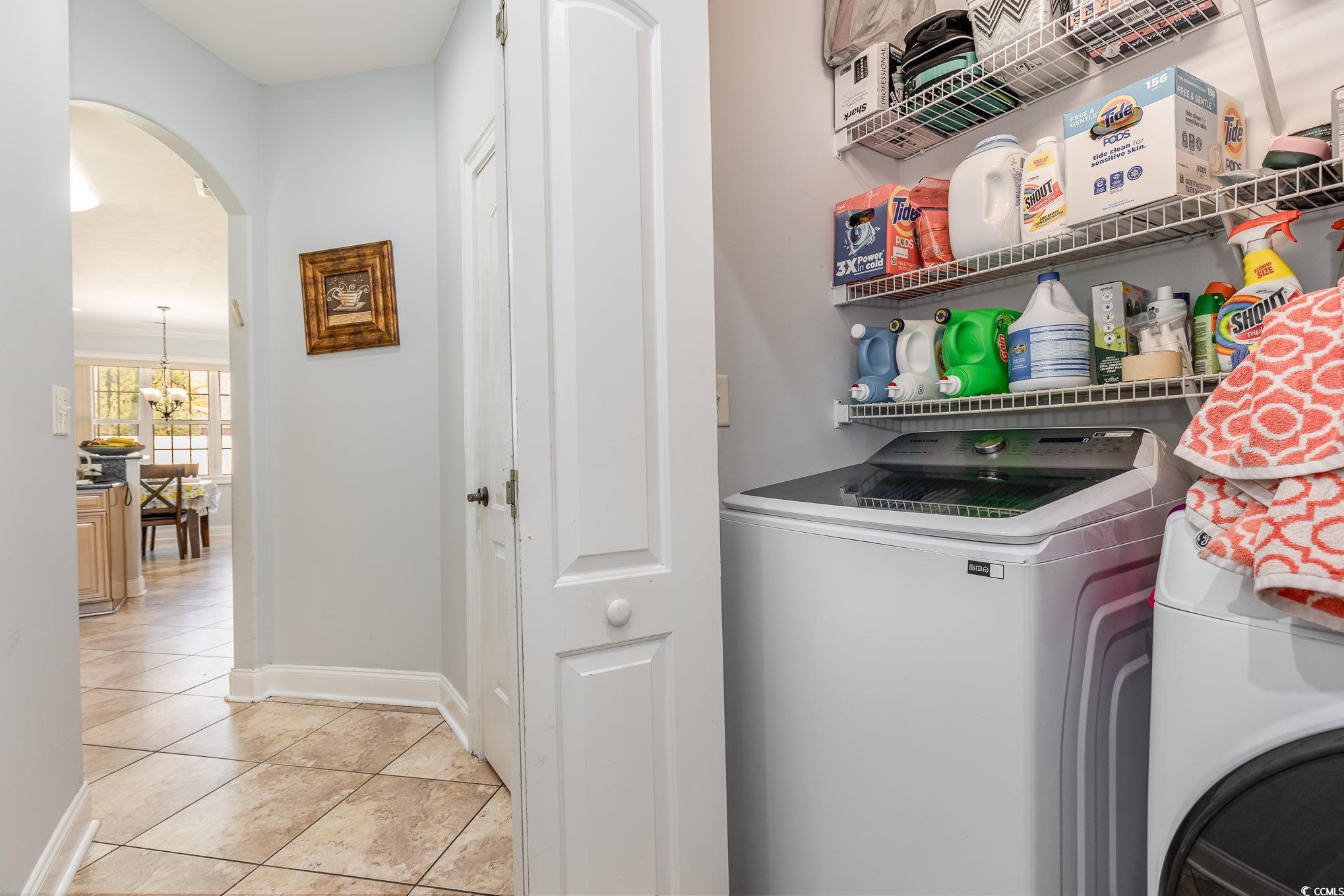 1069 Cole Court Myrtle Beach, SC 29577 - Photo 24 of 40 Laundry room with arched walkways, light tile patterned flooring, and independent washer and dryer