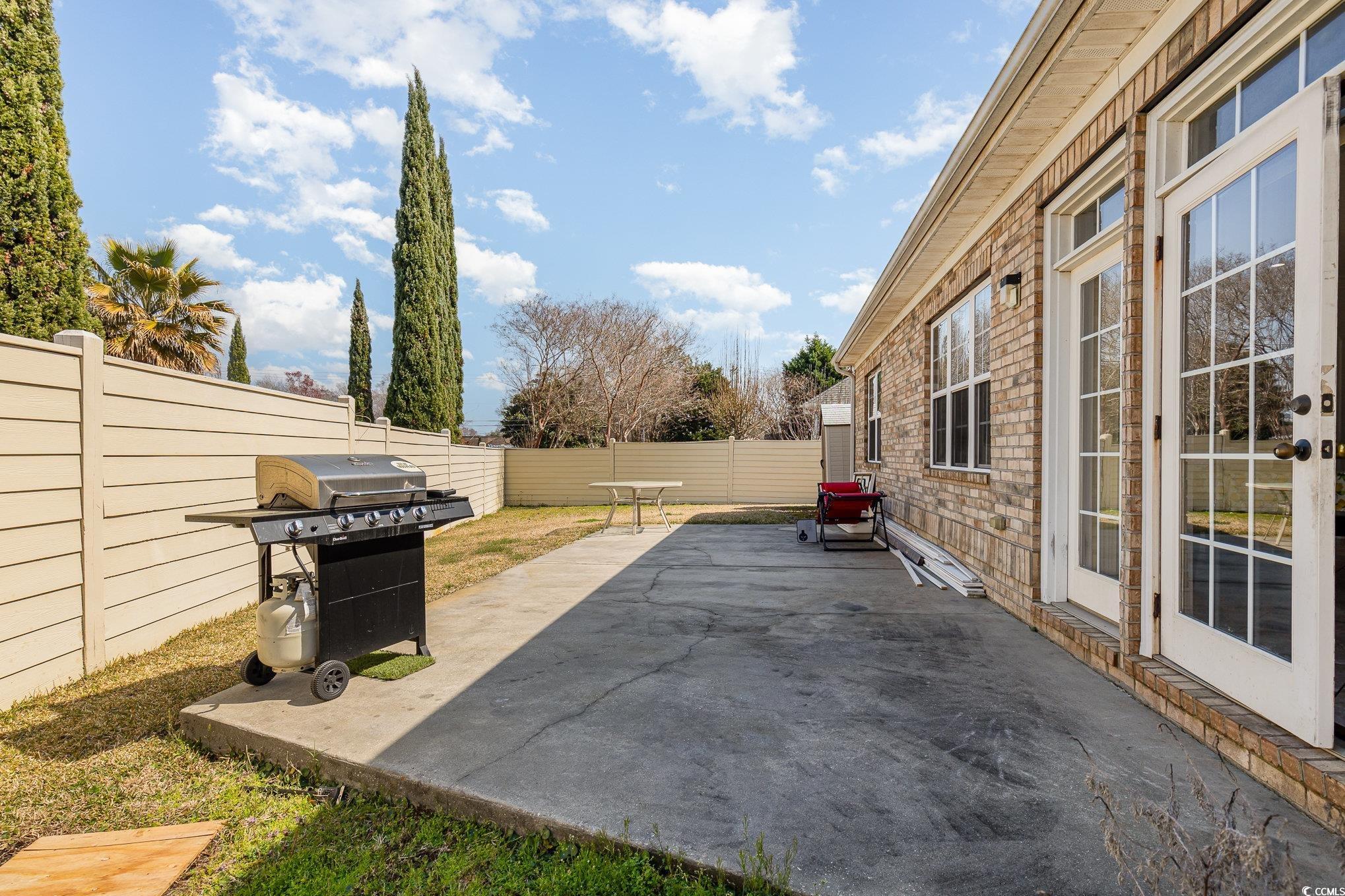 1069 Cole Court Myrtle Beach, SC 29577 - Photo 35 of 40 Fenced backyard featuring a patio area and grilling area