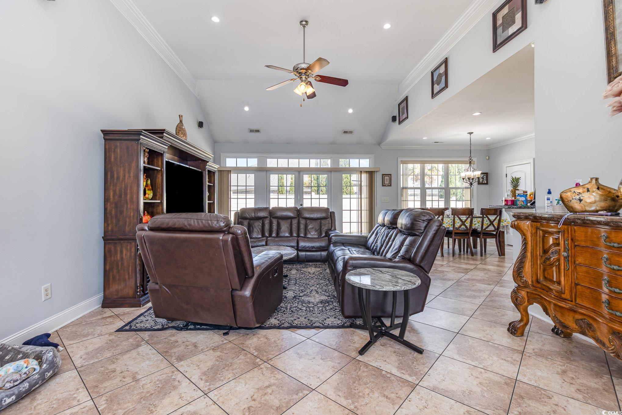 1069 Cole Court Myrtle Beach, SC 29577 - Photo 5 of 40 Living area featuring crown molding, vaulted ceiling, recessed lighting, a ceiling fan, and light tile patterned floors