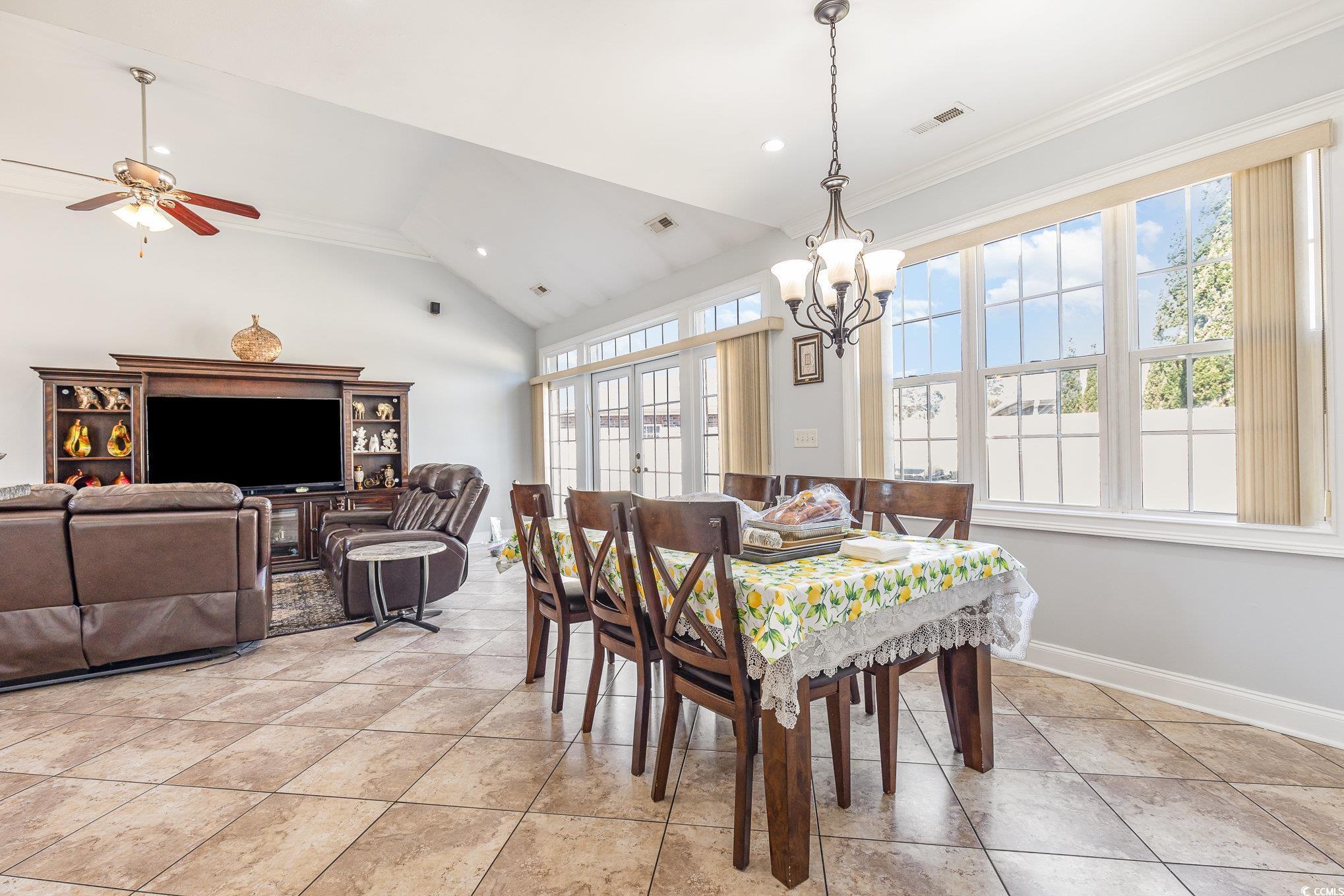 1069 Cole Court Myrtle Beach, SC 29577 - Photo 7 of 40 Dining area with plenty of natural light, high vaulted ceiling, ornamental molding, recessed lighting, and light tile patterned floors