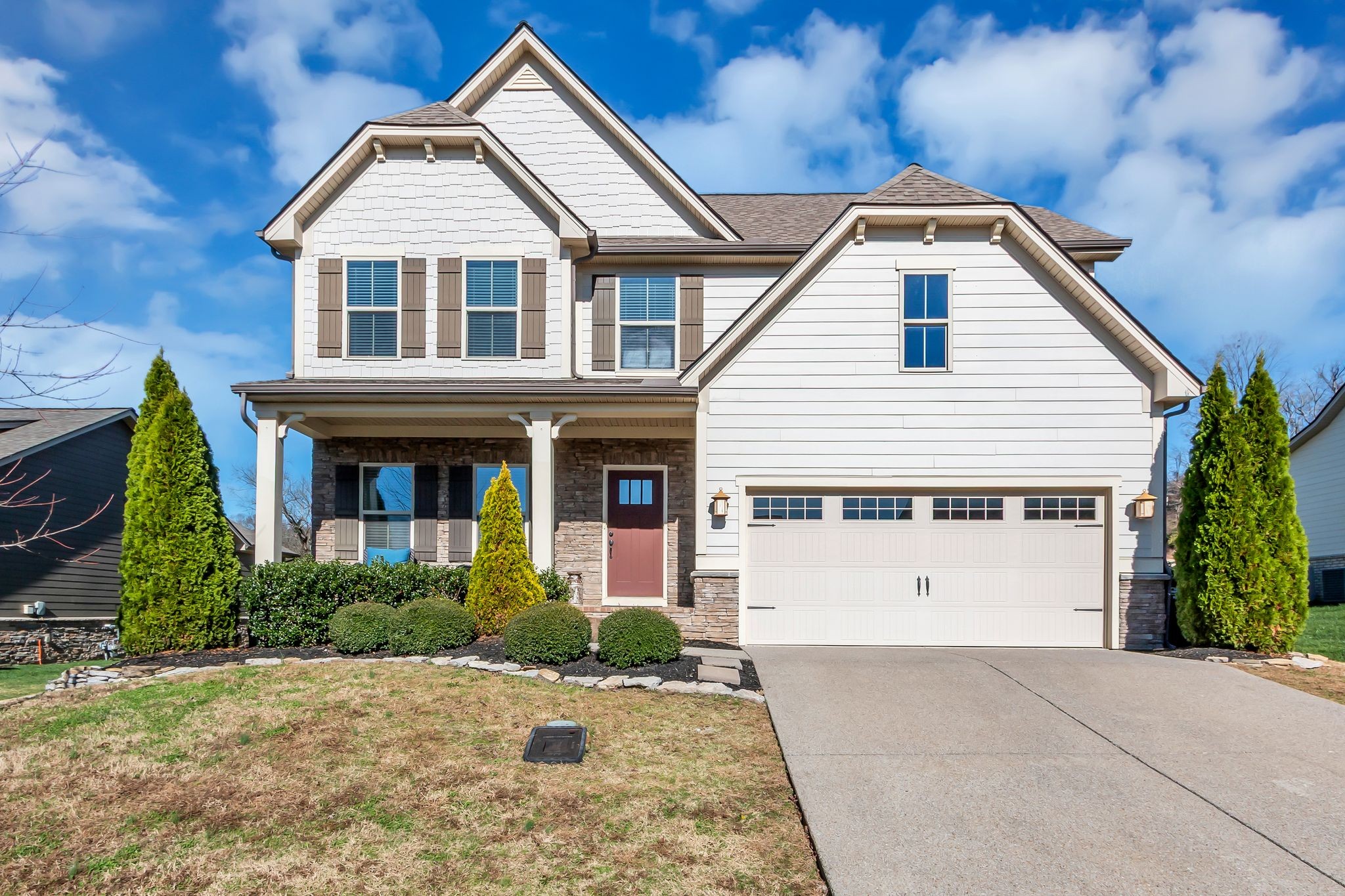 a front view of a house with a yard