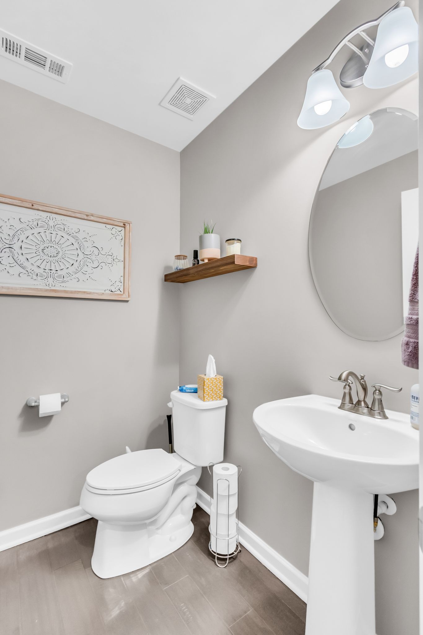 6930 Wellsford Lane College Grove, TN 37046 - Photo 17 of 44 a bathroom with a sink a toilet and mirror
