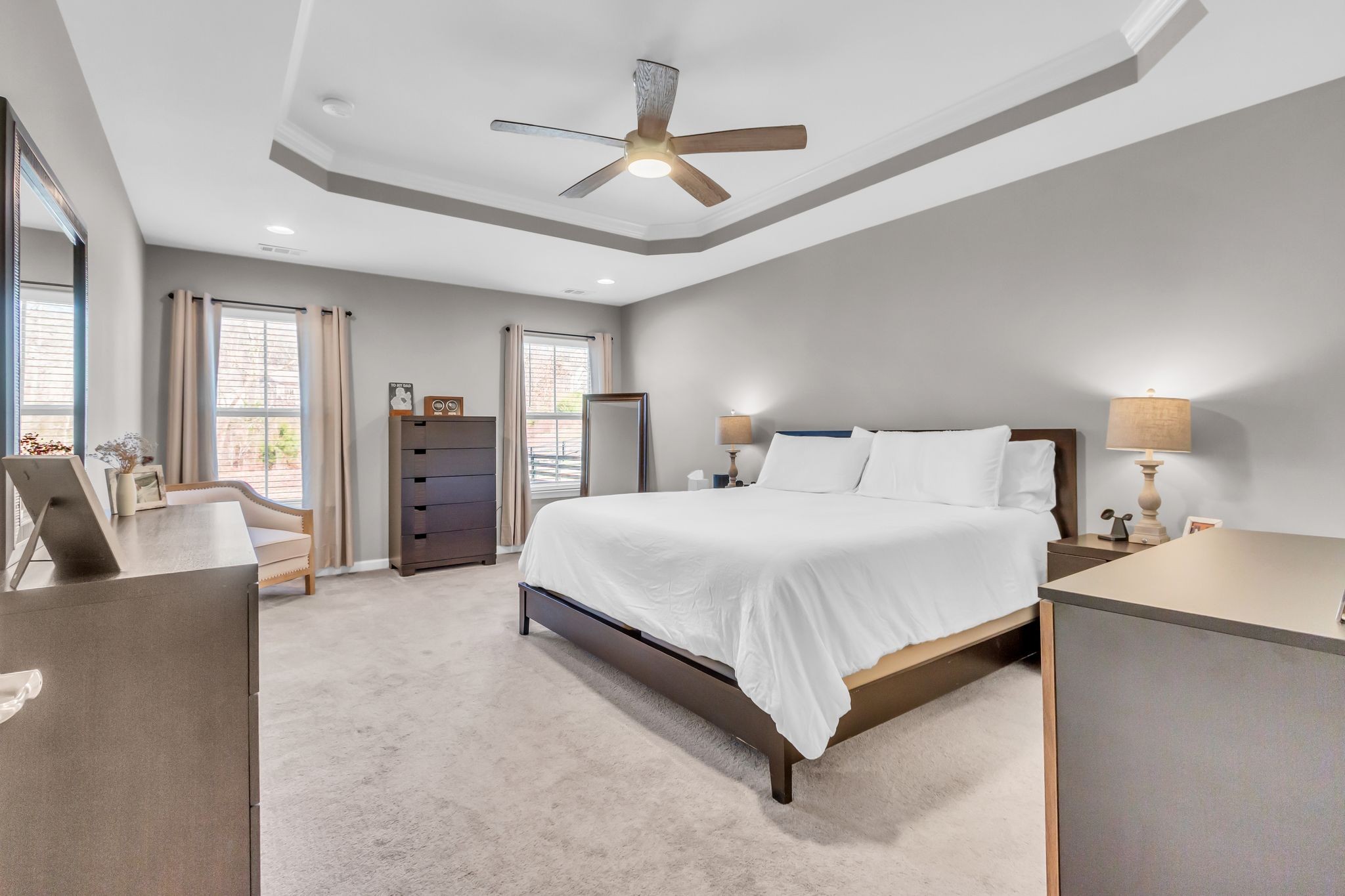 6930 Wellsford Lane College Grove, TN 37046 - Photo 18 of 44 a spacious bedroom with a bed and ceiling fan