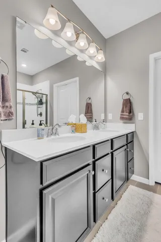a bathroom with a sink a vanity and a mirror