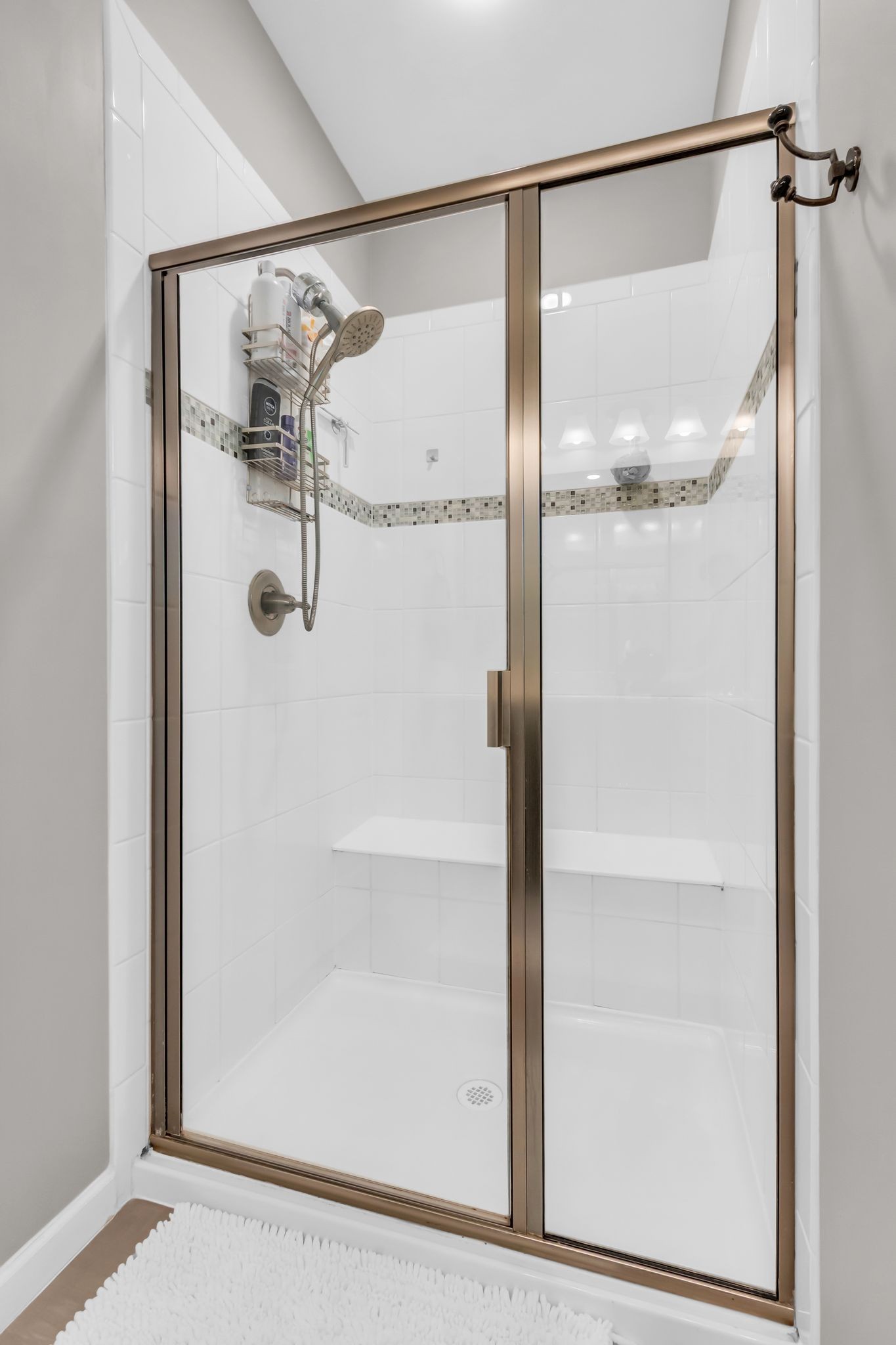 6930 Wellsford Lane College Grove, TN 37046 - Photo 22 of 44 a bathroom with a glass shower door