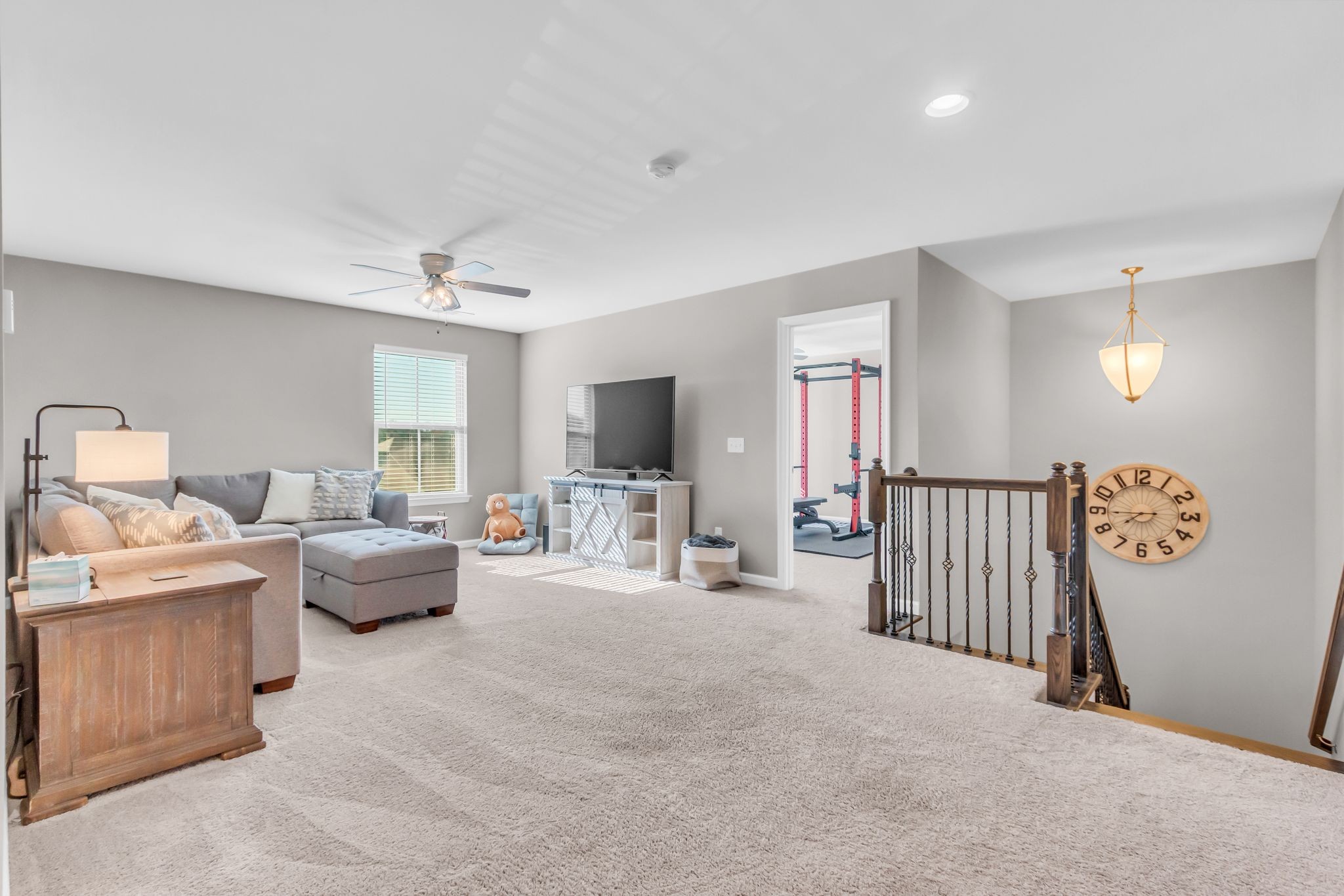 6930 Wellsford Lane College Grove, TN 37046 - Photo 23 of 44 a living room with furniture and a flat screen tv