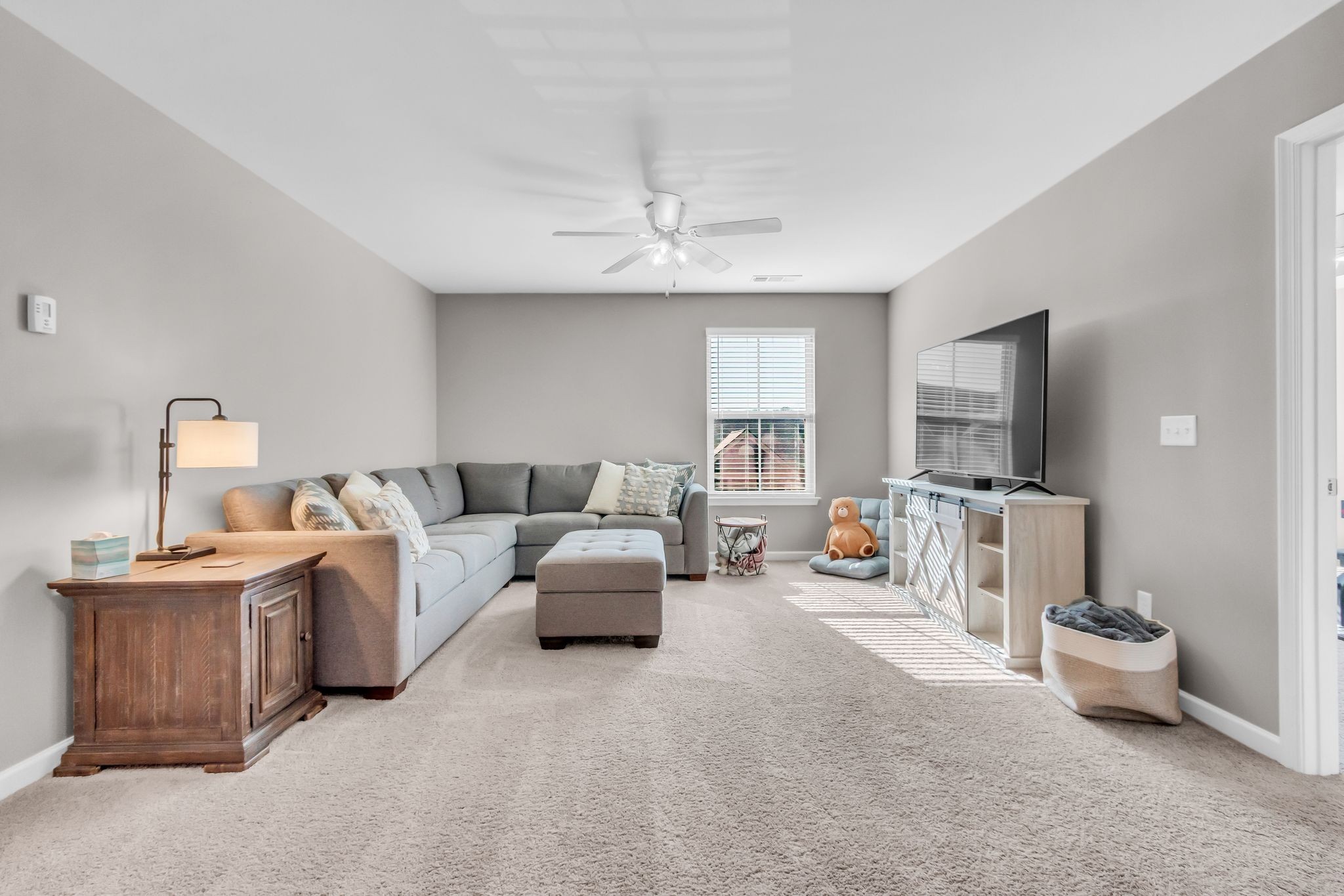 6930 Wellsford Lane College Grove, TN 37046 - Photo 24 of 44 a living room with furniture and a flat screen tv