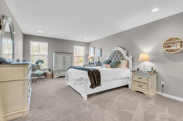 a bedroom with bed and a dresser