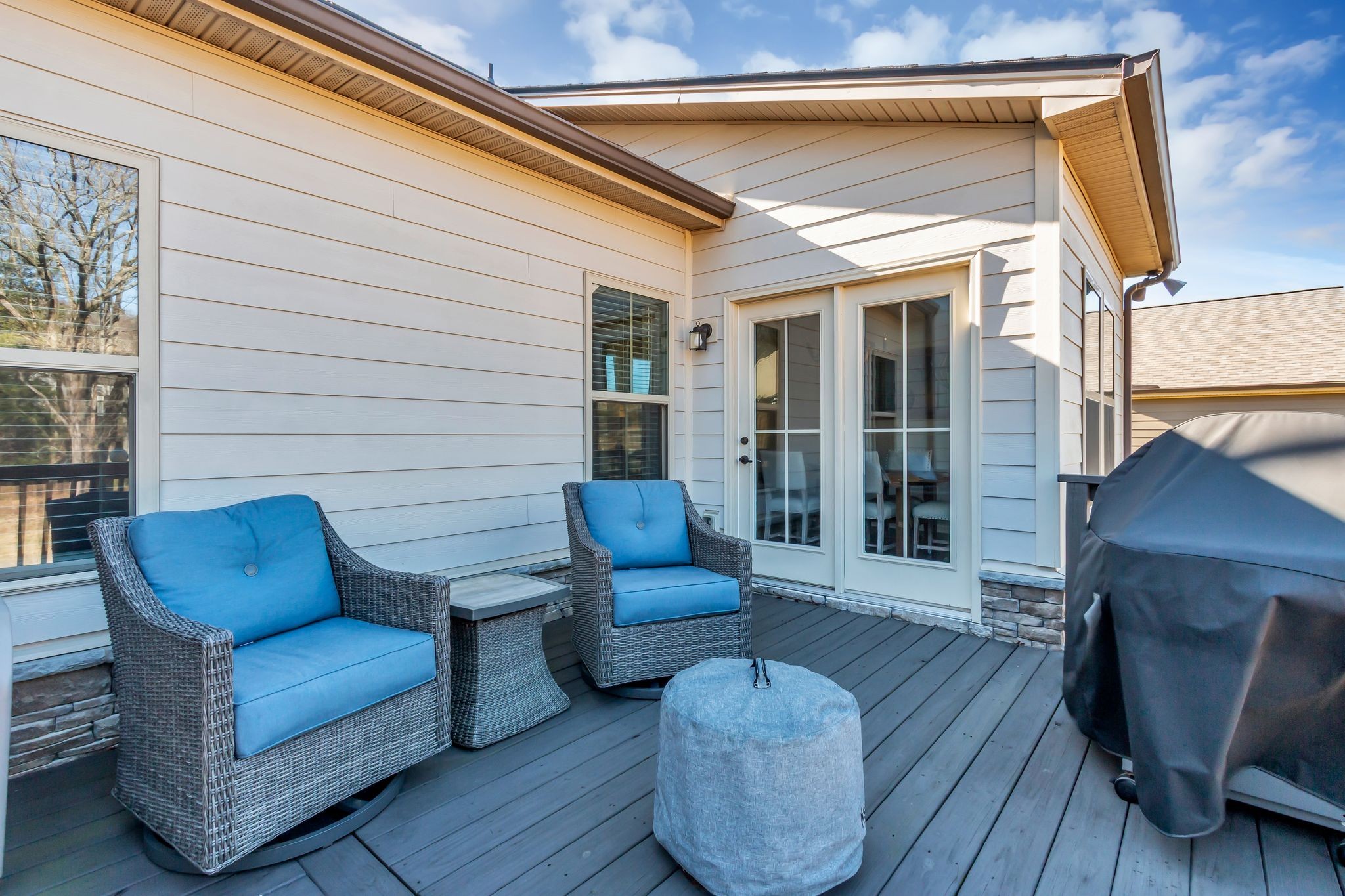 6930 Wellsford Lane College Grove, TN 37046 - Photo 33 of 44 a view of a patio with couches chairs and wooden floor