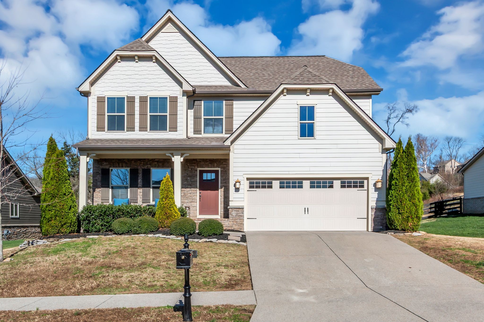 6930 Wellsford Lane College Grove, TN 37046 - Photo 43 of 44 a front view of a house with garage