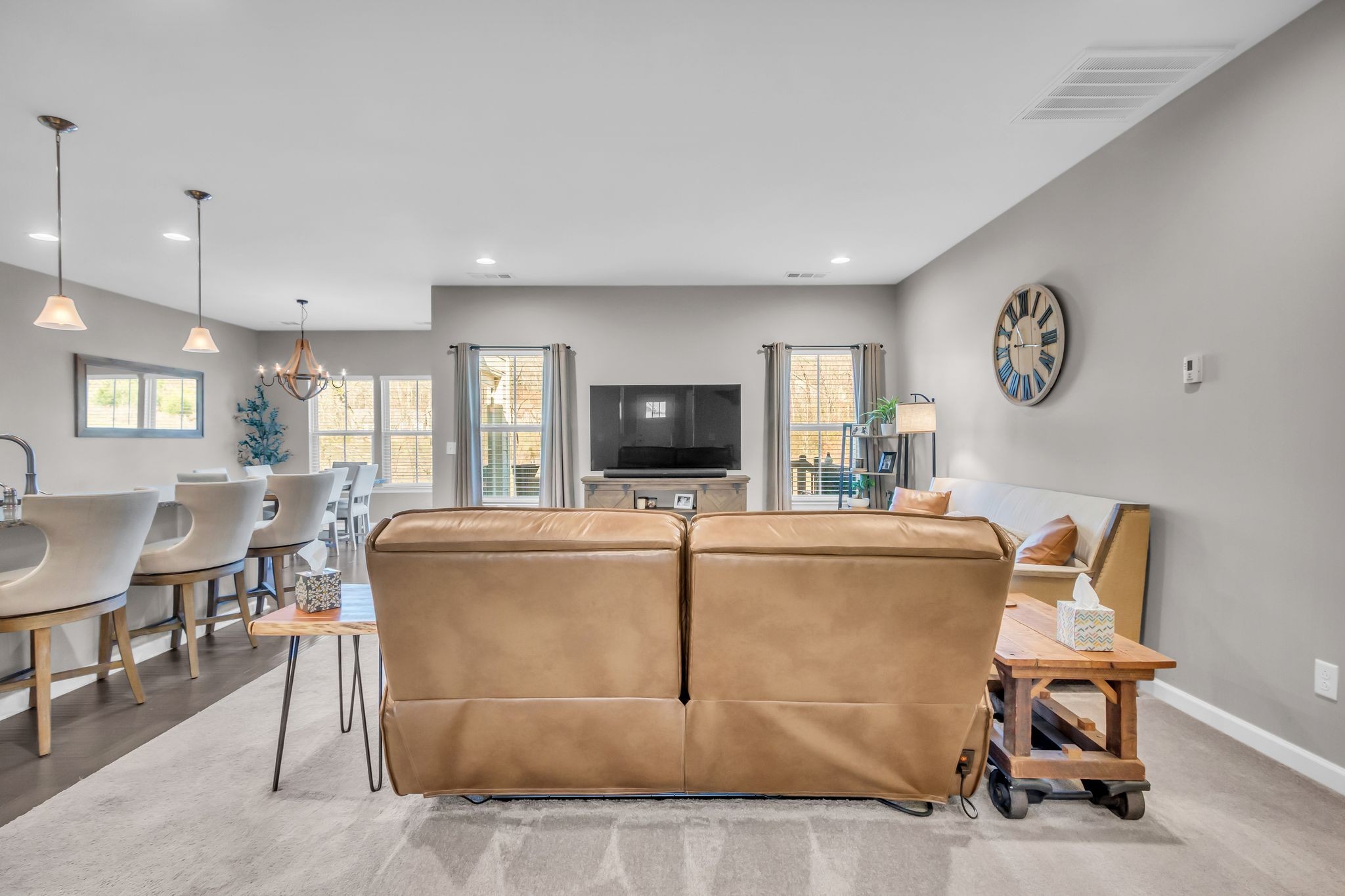 6930 Wellsford Lane College Grove, TN 37046 - Photo 7 of 44 a living room with furniture a flat screen tv and kitchen view