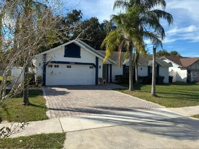 a house with a yard and entertaining space