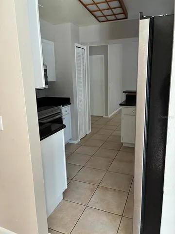 a view of a kitchen from the hallway