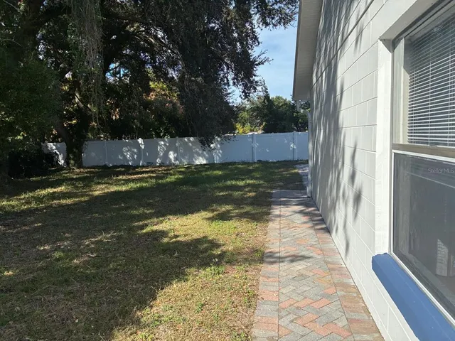 a view of backyard with green space