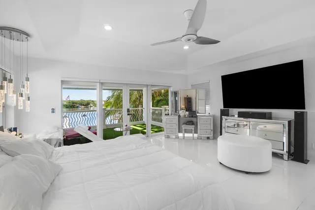 a sitting area with lake view and a yard