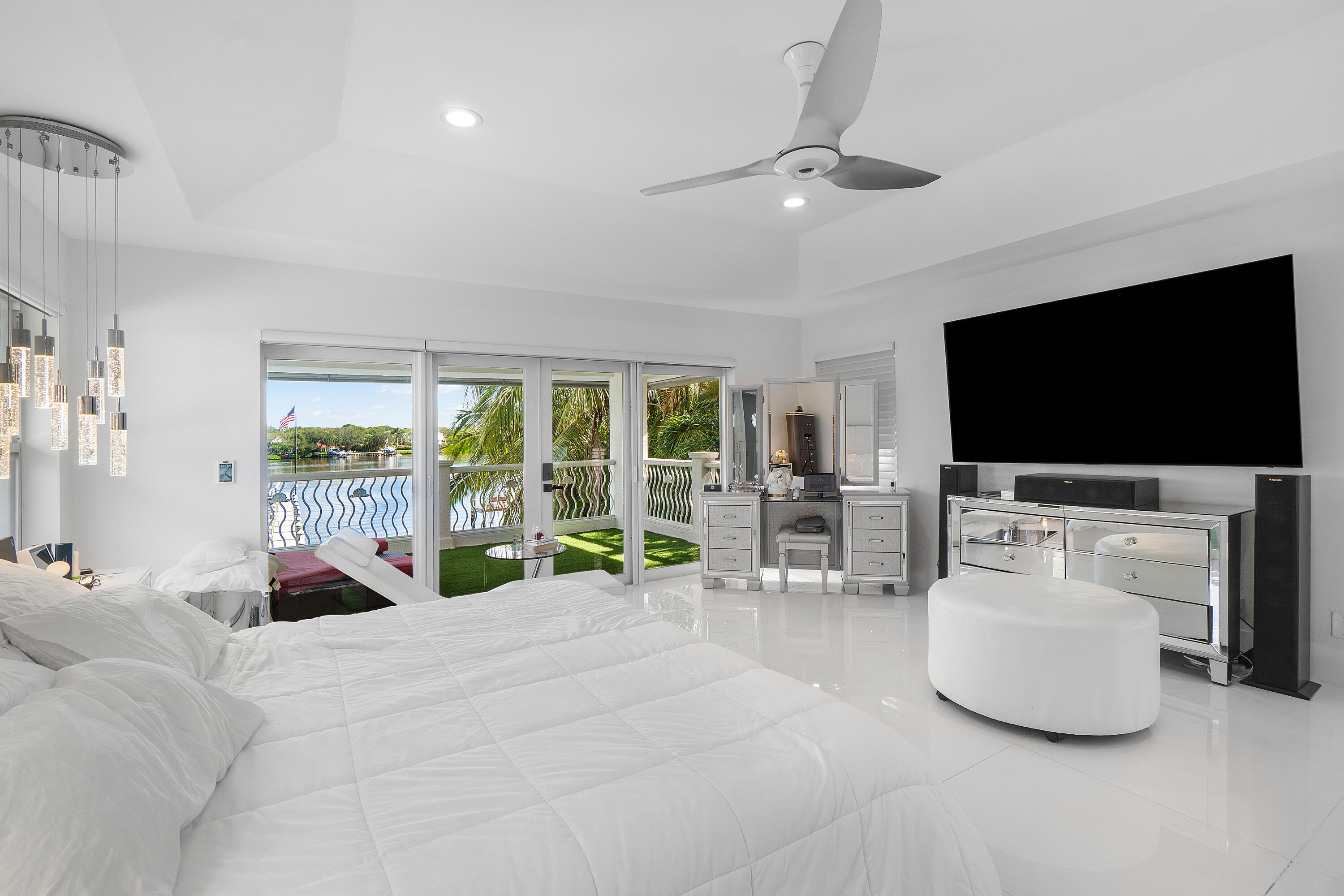 5447 Center Street Jupiter, FL 33458 - Photo 30 of 60 a living room with furniture and a flat screen tv