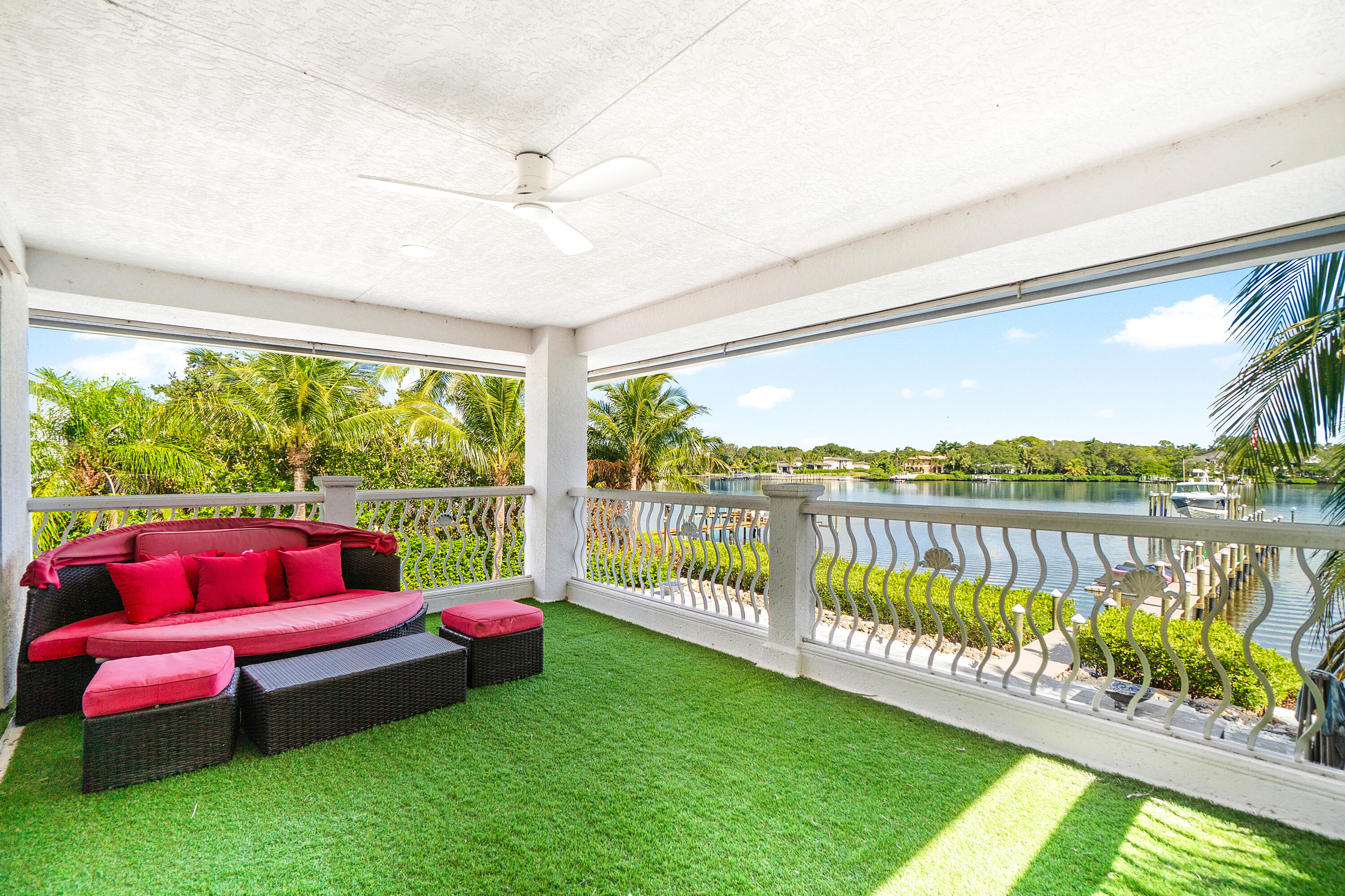 5447 Center Street Jupiter, FL 33458 - Photo 33 of 60 a sitting area with lake view and a yard