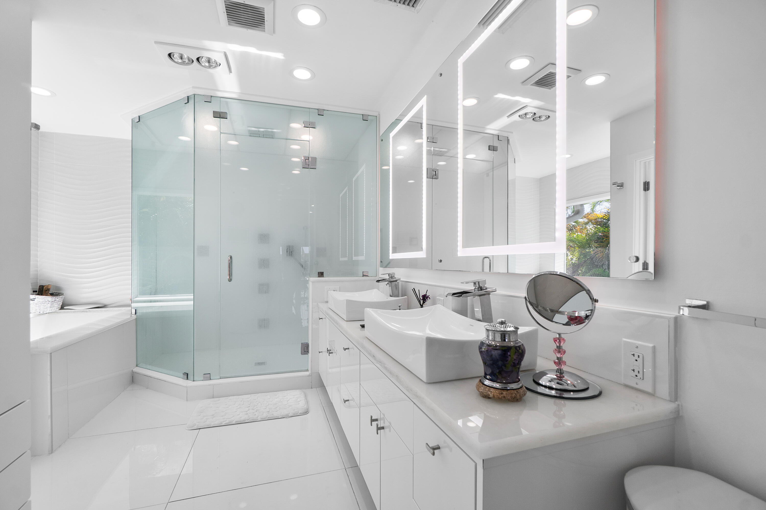 5447 Center Street Jupiter, FL 33458 - Photo 37 of 60 a bathroom with a sink a toilet and shower