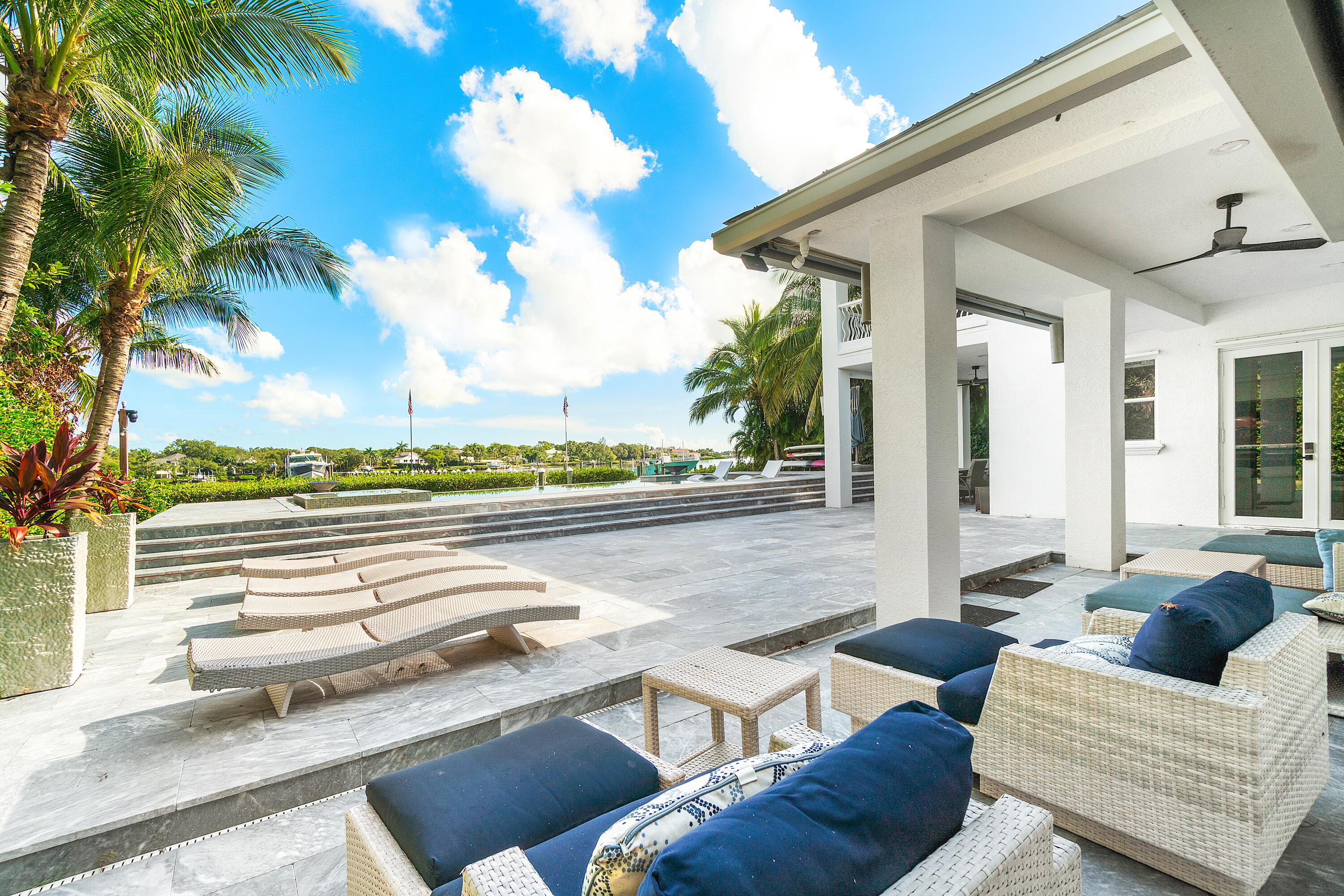 5447 Center Street Jupiter, FL 33458 - Photo 39 of 60 a view of balcony with couches and wooden floor