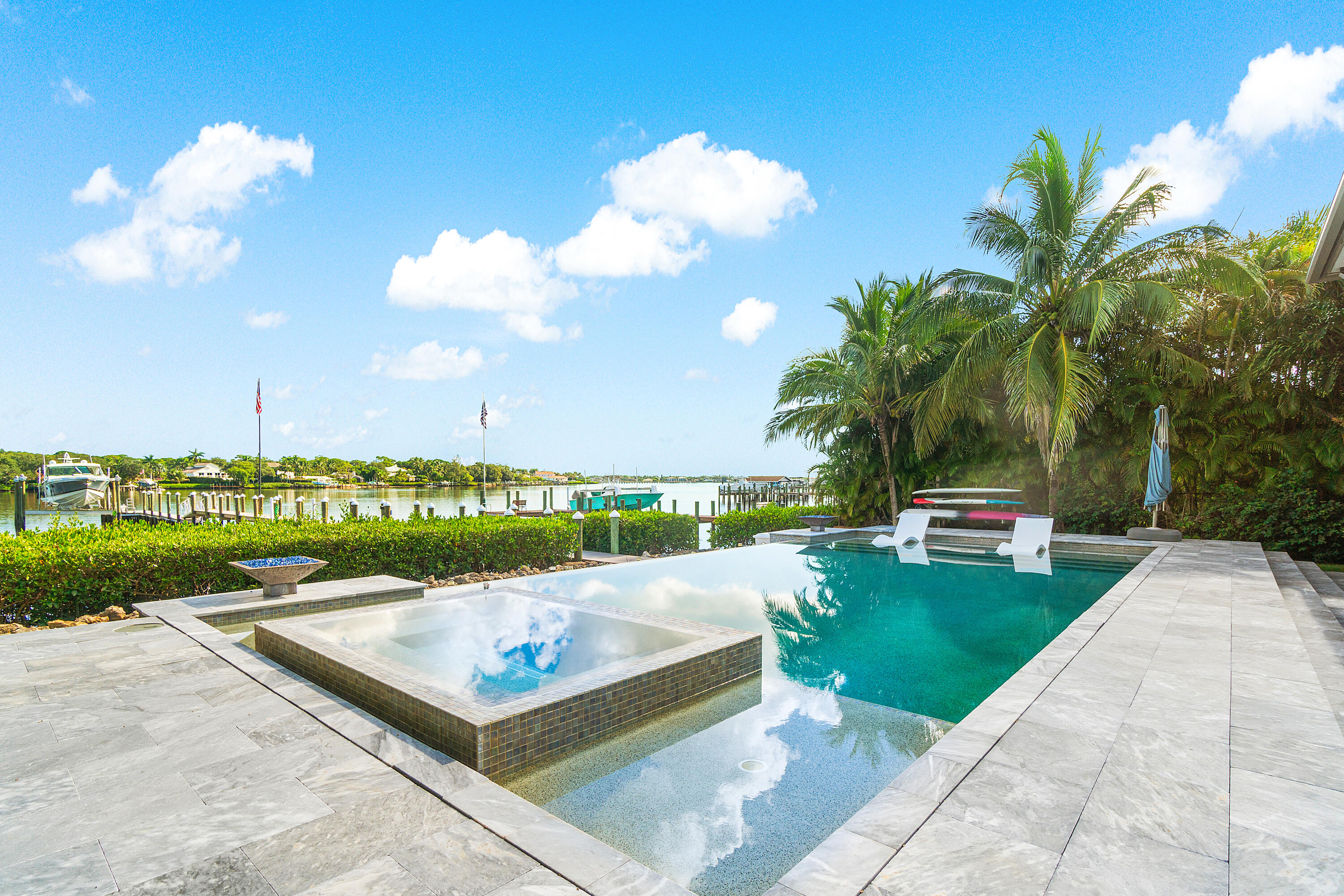 5447 Center Street Jupiter, FL 33458 - Photo 40 of 60 a view of a patio with a table and chairs
