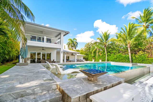 an aerial view of a houses with greenery