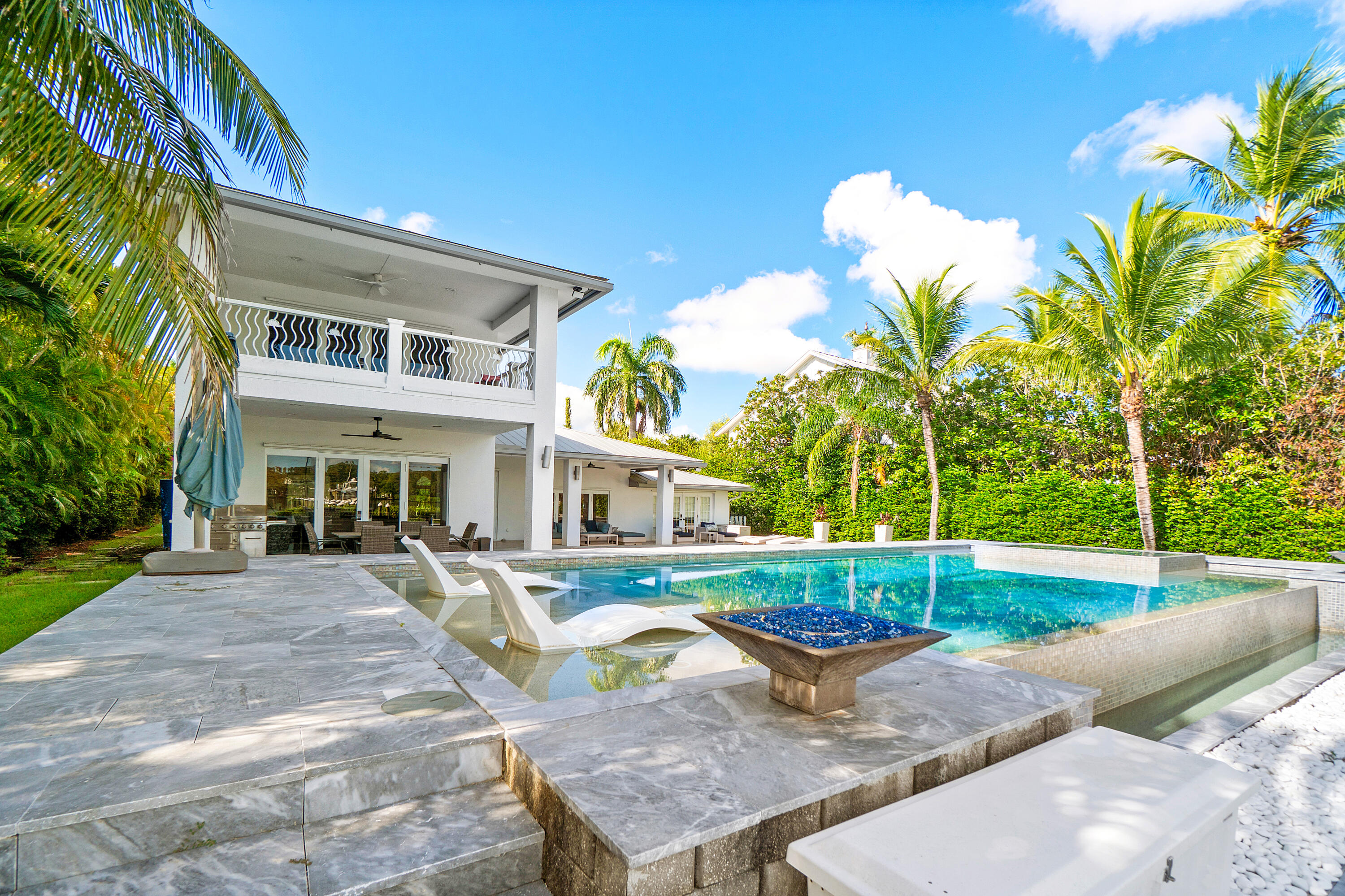 5447 Center Street Jupiter, FL 33458 - Photo 42 of 60 a view of a house with backyard and sitting area