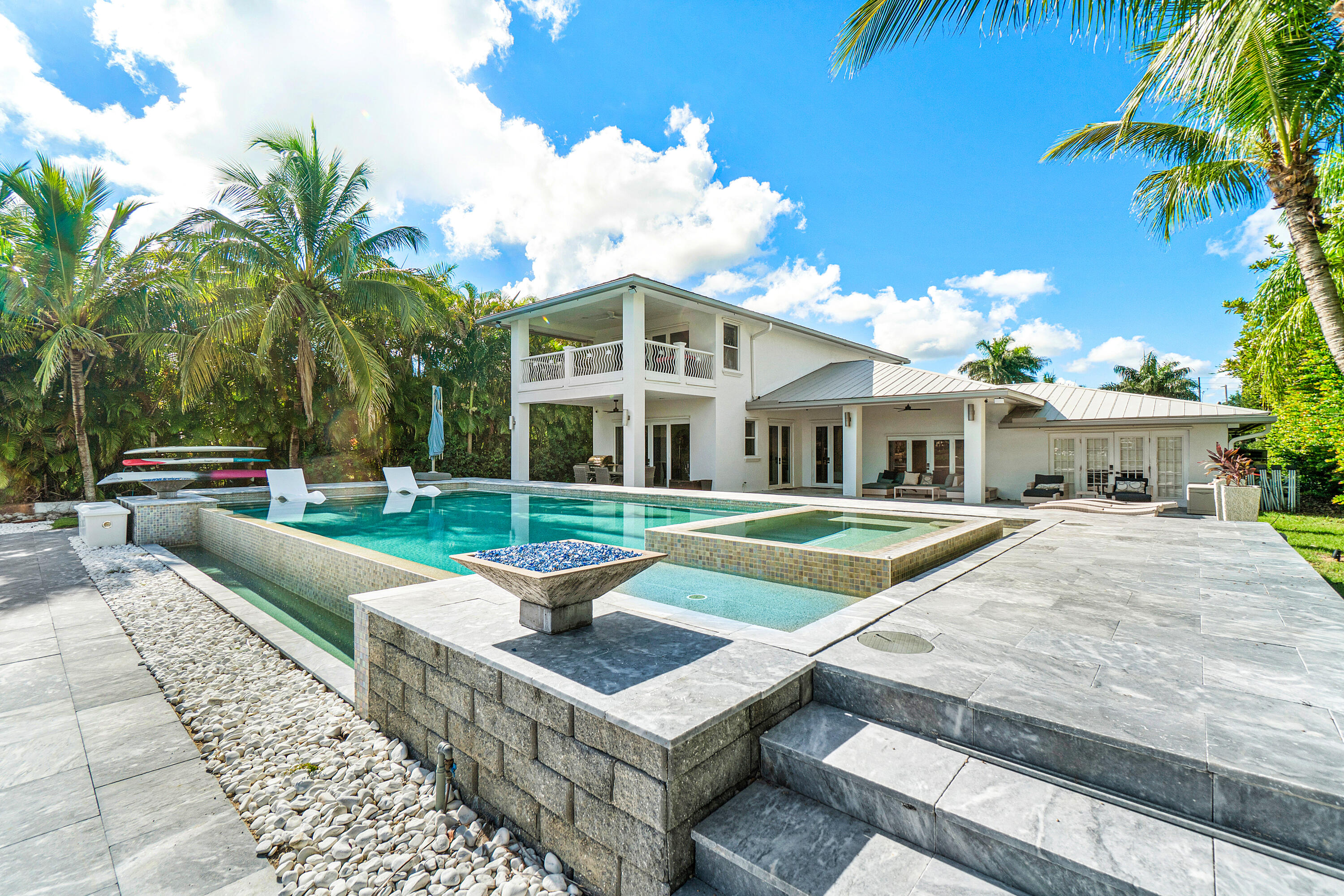 5447 Center Street Jupiter, FL 33458 - Photo 43 of 60 a front view of house with yard and swimming pool