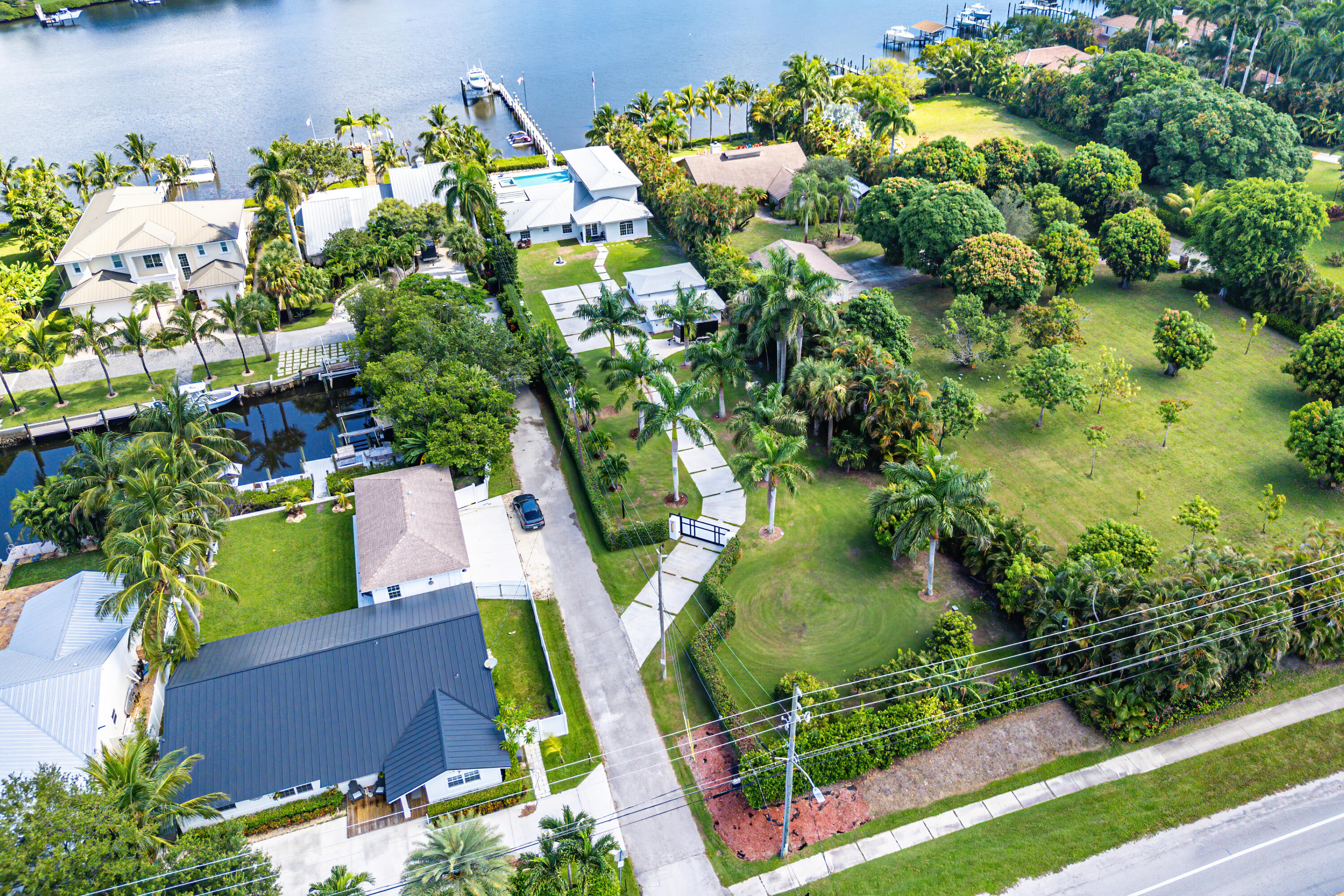 5447 Center Street Jupiter, FL 33458 - Photo 49 of 60 an aerial view of a houses with greenery