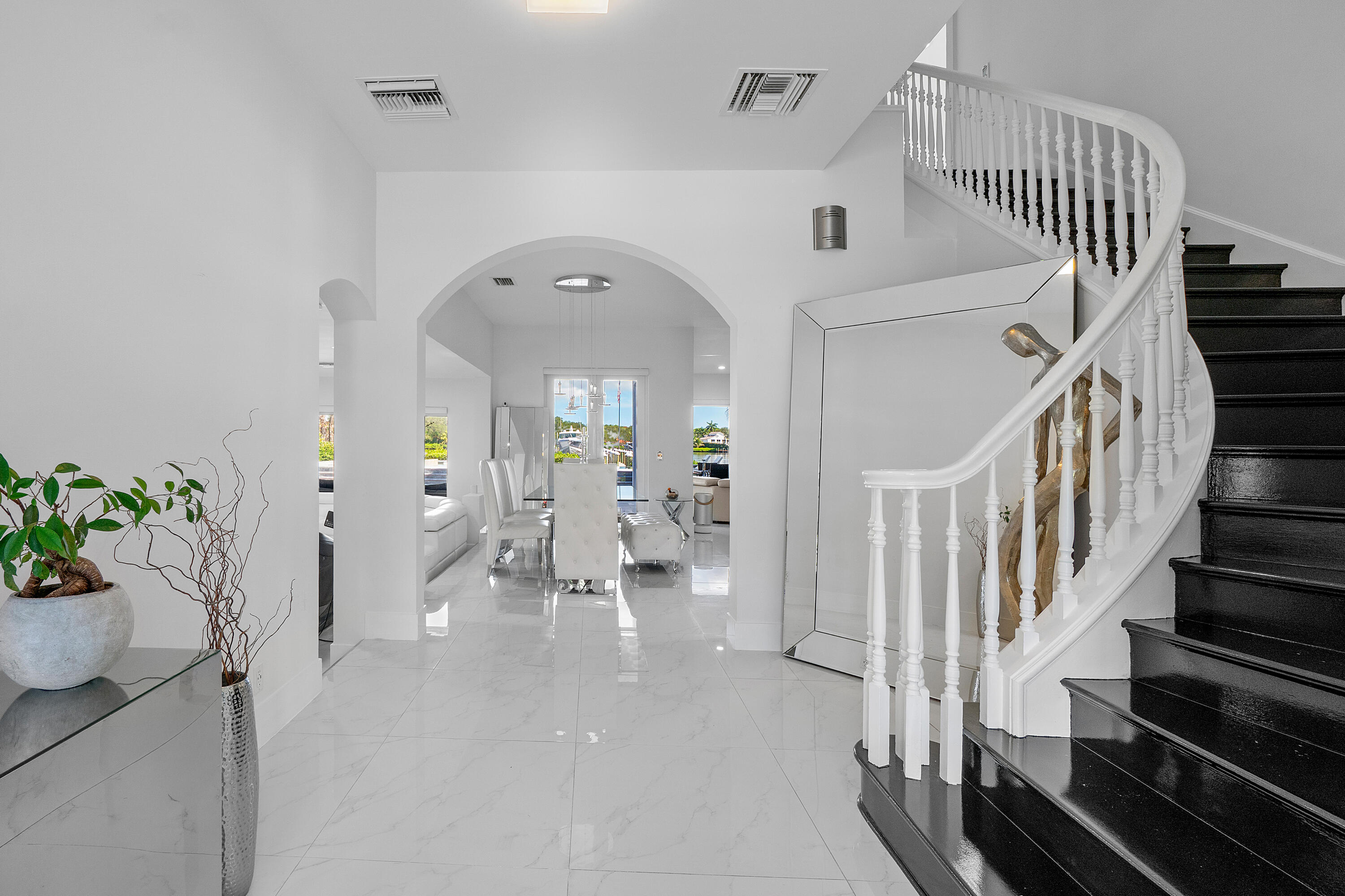 5447 Center Street Jupiter, FL 33458 - Photo 6 of 60 a view of entryway and hall with wooden floor