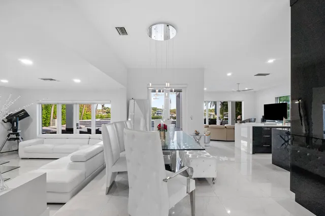 a living room with fireplace furniture and a flat screen tv