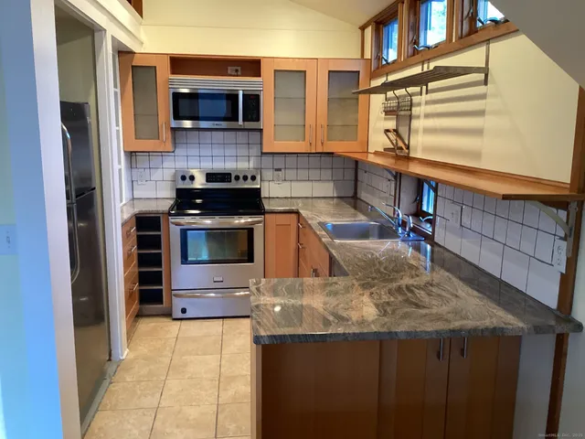 a kitchen with a stove and a kitchen