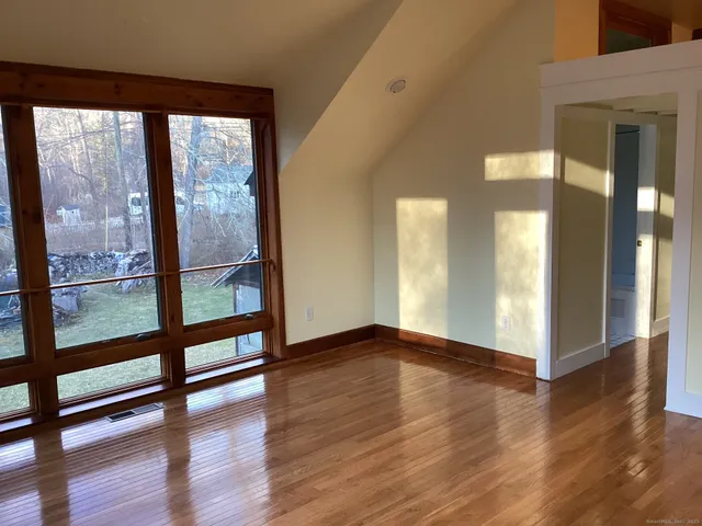 a view of a yard with large trees