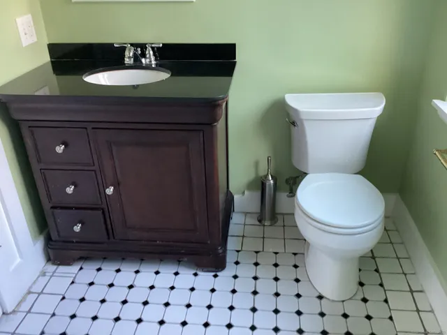 a bathroom with a bath tub with a shower