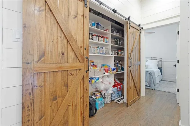 a dining room with furniture and a chandelier