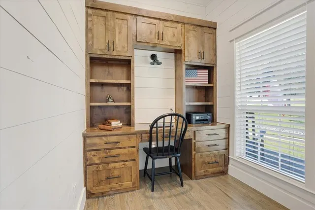 a view of a workspace with furniture